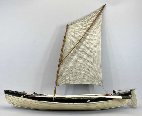 SCALE MODEL WHALEBOAT - of wooden construction, with single mast, the keel painted black and white, with oars and harpoons, 8