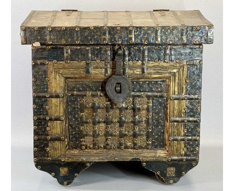 CONTINENTAL PINE TRUNK - of medieval appearance, heavily bound in metal and studded in brass with substantial iron lock plate