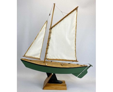 SCALE MODEL SAILING BOAT - of wooden construction, the hull painted green, the keel black, fully rigged with a stand, 71cms H