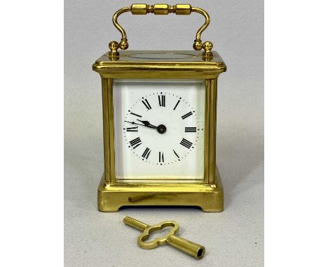 VINTAGE BRASS CARRIAGE CLOCK - with winding key having a white enamel dial set with Roman numerals, 13cms H handle up
