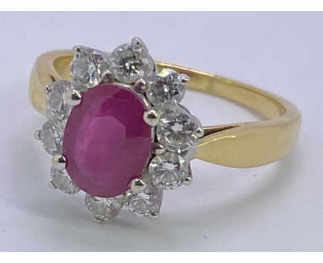 18CT GOLD PINK RUBY &amp; DIAMOND CLUSTER RING - in excess of 1ct facet cut oval central stone, 8 x 6mm, with a surround of 1