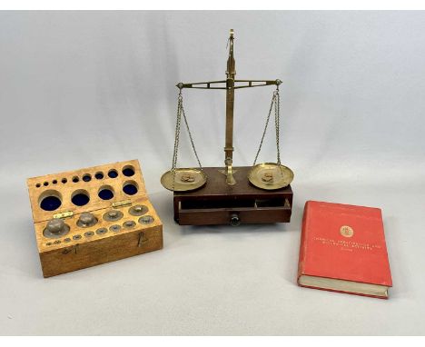 BRASS BEAM SCALE - late 19th century, on mahogany base with drawer, turned knob handle and bun feet, 42cms H, a set of 13 bra