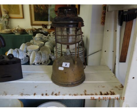 An early 20th century tilly lamp