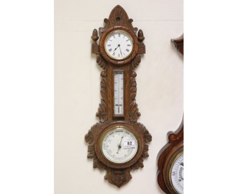 Late Victorian combined Aneroid Barometer, Thermometer and Clock contained in a Carved Oak Case featuring a ships anchor, 64c