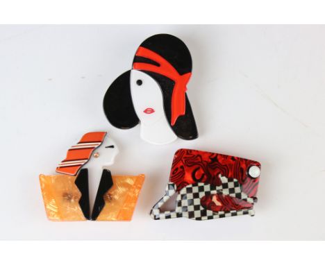 A collection of three Lea Stein style brooches to include an Art Deco lady. 