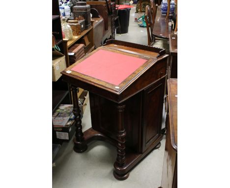 Victorian figured Walnut Davenport, the inset sloping hinged writing surface opening to a fitted interior, cupboard to side o