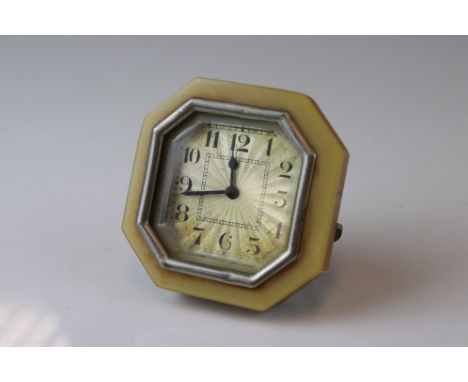An early 20th century Art Deco travel clock with bakelite surround. 
