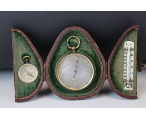 A cased Dixey's of Brighton pocket barometer, thermometer and compass set. 