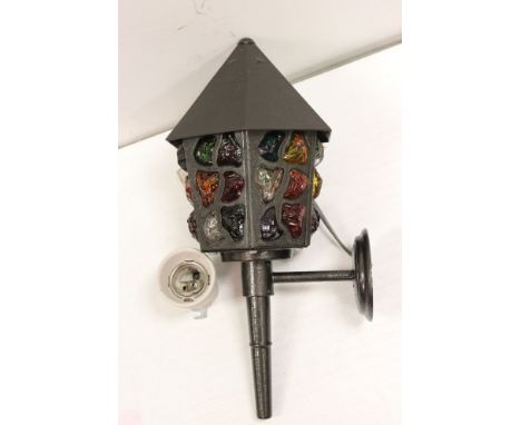 A contemporary porch light with decorative coloured glass. 