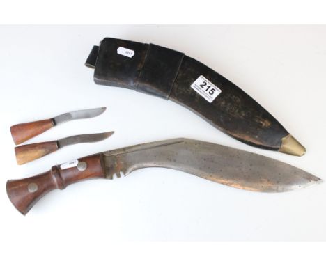 A military Kukri knife with original scabbard, marked with the broad arrow and stamped India. 