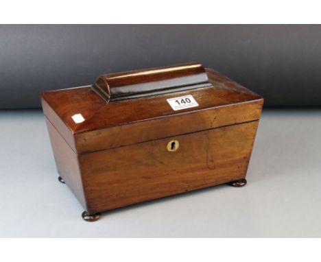 Regency Mahogany sarcophagus Tea Caddy with fitted interior and raised on squat bun feet, 28cms wide 