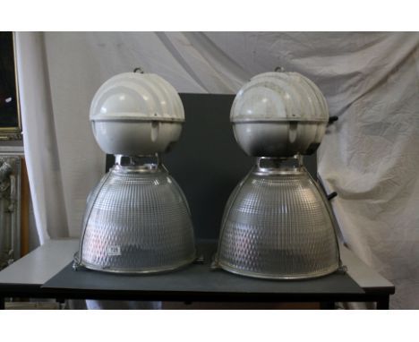 A pair of Holophone industrial hanging light fittings with substantial glass shades, height approx 60cm, diameter approx 40cm