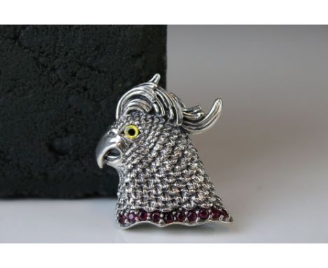 Silver pendant-brooch in the form of a parrot with ruby platform 