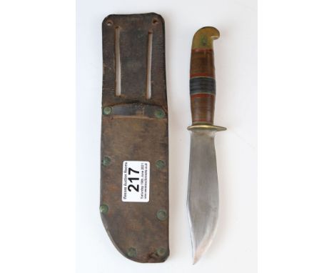 A vintage scouting knife with original scabbard. 