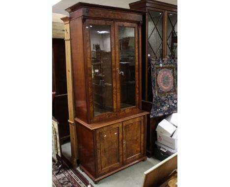 Early Victorian Walnut Bookcase Cabinet with two glazed doors enclosing adjustable shelves, the base with two panelled doors 