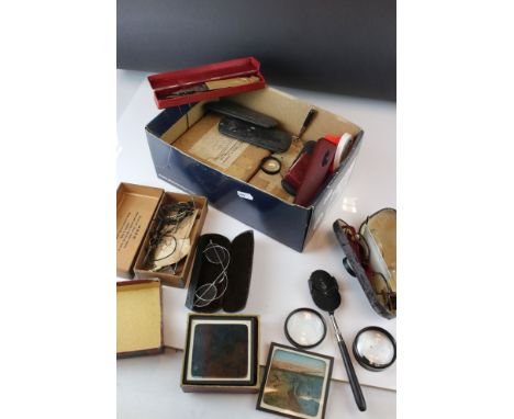 A box of mixed collectables to include cased glasses and opticians tools. 
