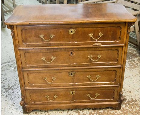 COMMODE, 19th century German walnut, circa 1870, with a serpentine top and four long drawers with carved detail, 97cm x 52cm 