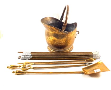 A Brass coal helmet, fire irons, Brass stair rails and clips