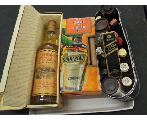 A bottle of Glenmorangie 10 year old Single Highland Malt Scotch Whisky, a bottle of Cointreau plus a collection of spirit mi