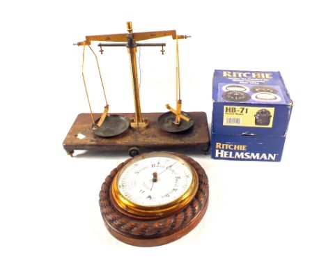 A circular Oak barometer, Ritchie marine compass and a chemical balance