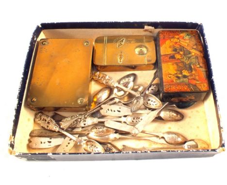 A Victorian papier mache figure painted snuff box, one other Brass, a German Brass stamp box plus various white metal spoons