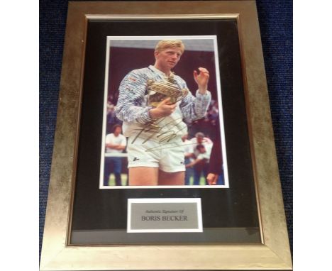 Tennis Boris Becker signed 20x14 overall framed and mounted colour photo pictured holding the Wimbledon Mens singles trophy. 