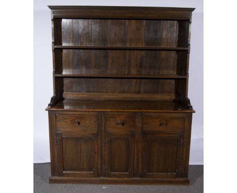 Oak dresser, two shelf delft rack, the base fitted with three drawers over three panelled doors, width 152cms.