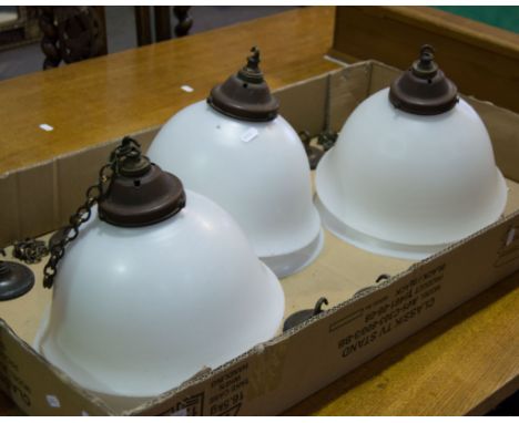 Set of six opaque glass hanging light shades, metal fittings.