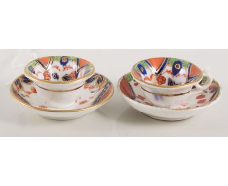 Two Staffordshire miniature teacups and saucers, 19th Century, decorated in the Imari palette, (4).