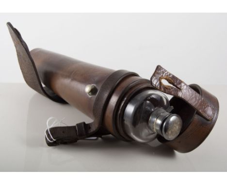 Hunting flask in leather holder, tapered glass bottle with plated bayonet cap.