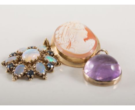 Two pendants and a brooch, a modern oval carved shell cameo brooch pendant 25mm x 20mm in a 750 yellow metal mount, a 15mm ci
