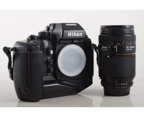 Nikon FE2 camera, a similar FA4 camera together with fittings and accessories in a large camera case holdall.
