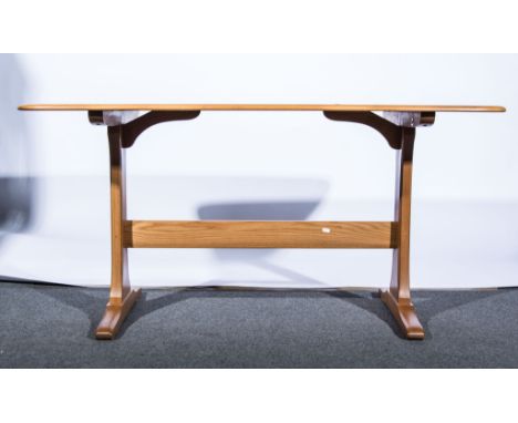 Lucian Ercolani for Ercol, an elm and beech trestle dining table, applied gold label, length 151cms, width 85cms, height 73cm