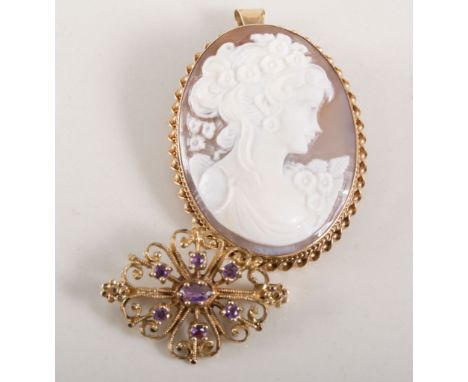 Oval carved shell cameo brooch/pendant, 40mm x 30mm, female profile facing right in a hallmarked 9 carat yellow gold mount wi