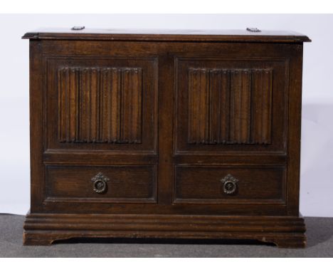 Reproduction oak mule chest, 18th Century style rectangular boarded top with moulded edge, two panels to the front with linen
