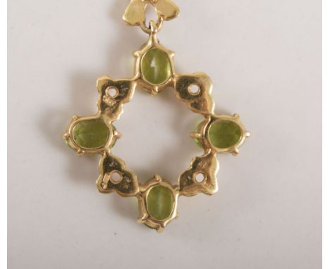 Three pendants, a 9 carat yellow gold reproduction of a seed pearl and sapphire six rayed star with brooch fitting on a 40cm 
