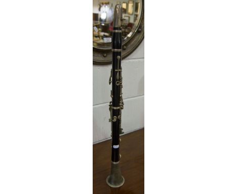 Corton Clarinet, ebonised and with metal mounts, length 67cms.
