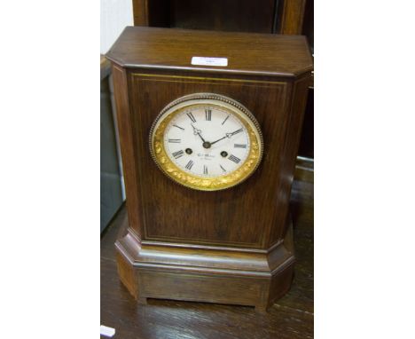 Henry Marc, rosewood and brass inlay mantel clock.
