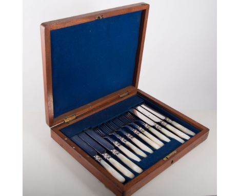 Set of six Victorian dessert knives and forks, fused blades, mother of pearl handles, in a mahogany case, other cased cutlery