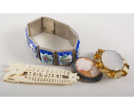 Jewel box containing twenty-one pieces of jewellery, a silver butterfly wing brooch, lava and shell cameos, paste crescent br