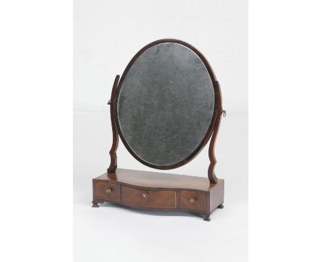 Regency mahogany dressing table mirror, the oval plate over a serpentine fronted base fitted with three drawers, each with pr