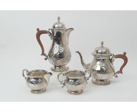 Modern silver four piece tea service, Birmingham 1966, in the early Georgian style comprising pear shaped teapot with wooden 