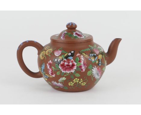 Chinese Yixing enamelled terracotta teapot, 19th Century, decorated with butterflies and flowers in the Canton style, incised