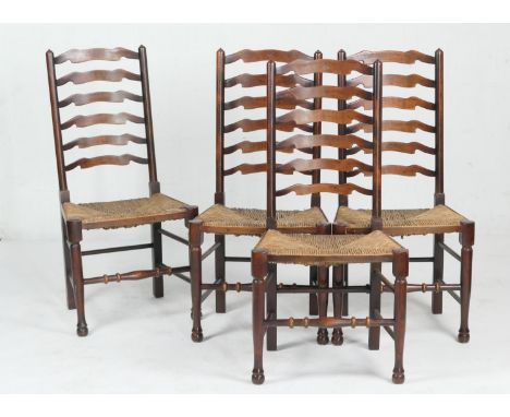 Set of four Arts and Crafts period stained beech  ladder back chairs, circa 1900, with rush seats, height 109cm 