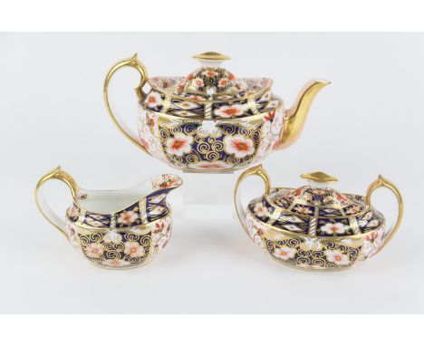 Royal Crown Derby imari tea service, the teapot circa 1894, the sucrier and milk jug 1939, pattern 2451, printed marks, the t