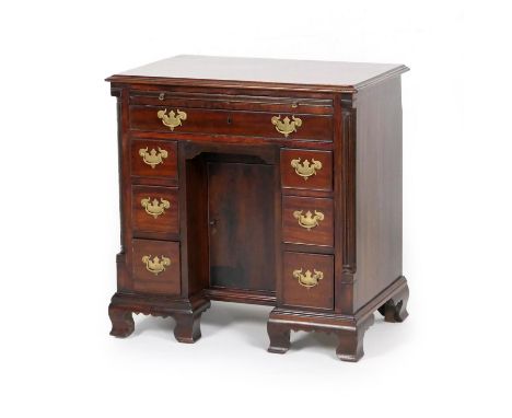 Mahogany kneehole desk in the Georgian style, 19th Century, moulded top over a brushing slide and upper long drawer, with thr