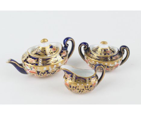 Royal Crown Derby miniature tea service, circa 1907, decorated in imari style, pattern 6299, comprising lidded teapot, 3.5cm,