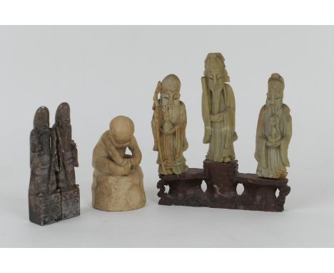 Chinese soapstone carving, featuring three Immortals, on a base, height 18cm; also two carved soapstone figures of Shoulao, 1