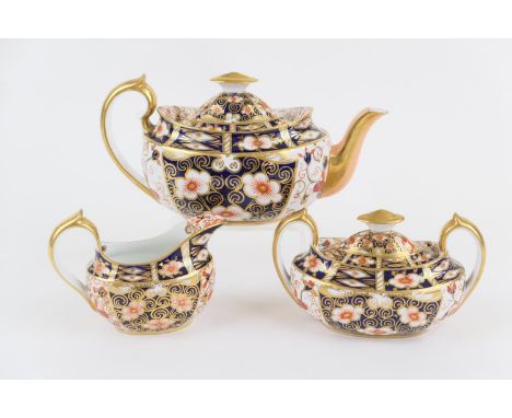 Royal Crown Derby imari tea service, circa 1901 and 1929, pattern 2451, comprising lidded teapot, lidded sucrier, and milk ju