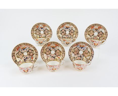 Six Derby old imari cups and saucers, circa 1800-25, the pattern akin to 6299, painted red baton marks (12) 